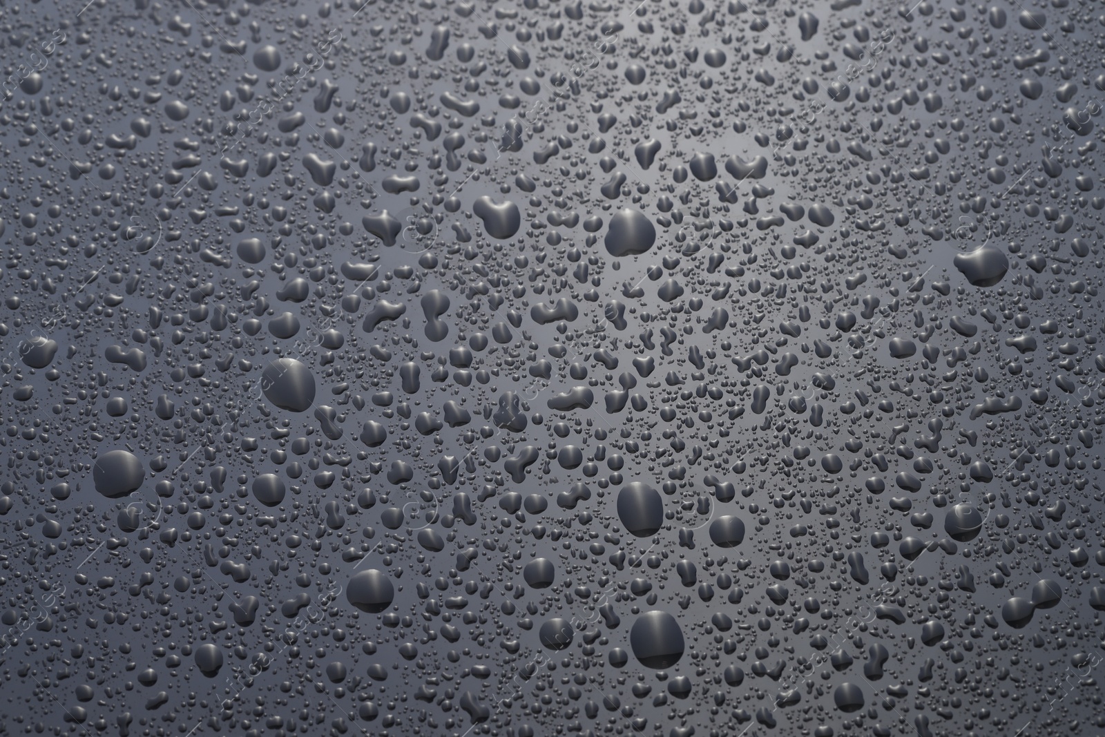 Photo of Water drops on grey glass surface, top view