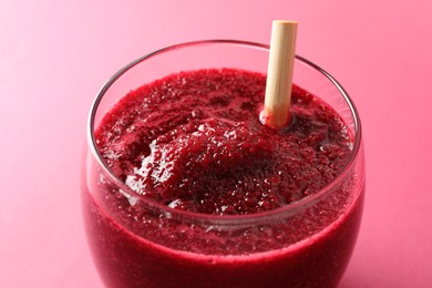 Photo of Fresh beetroot smoothie in glass on pink background, closeup