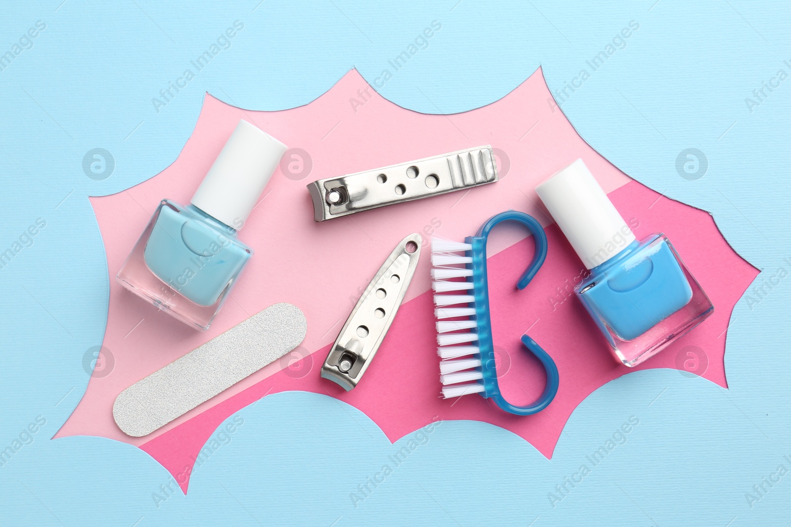 Photo of Set of pedicure tools on color background, flat lay