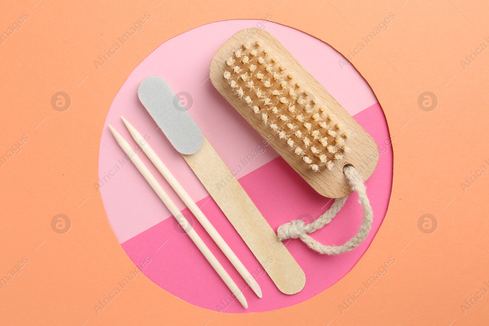 Photo of Set of pedicure tools on color background, flat lay