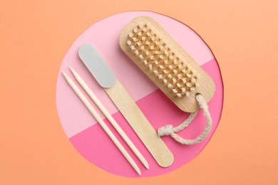 Photo of Set of pedicure tools on color background, flat lay