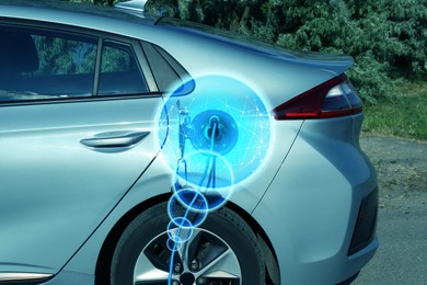 Image of Charging modern electric car from station outdoors. Round pulse waves representing energy