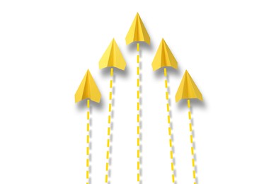 Image of Yellow paper planes with flight paths on white background. Dashed lines for trajectory