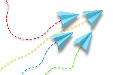 Image of Light blue paper planes with flight paths on white background. Dashed lines for trajectory