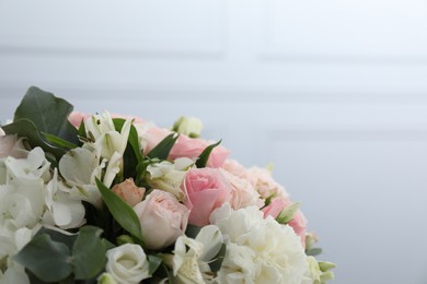 Photo of Bouquet of beautiful flowers on light background, closeup. Space for text