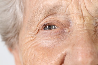 Photo of Senior woman with beautiful eyes, macro view