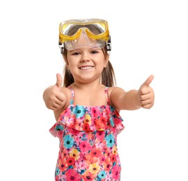 Cute little girl in swimsuit showing thumbs up on white background