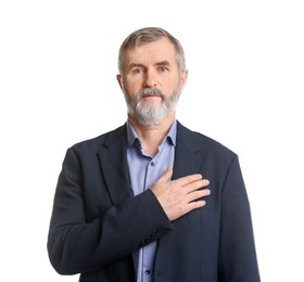 Mature man making promise on white background. Oath gesture