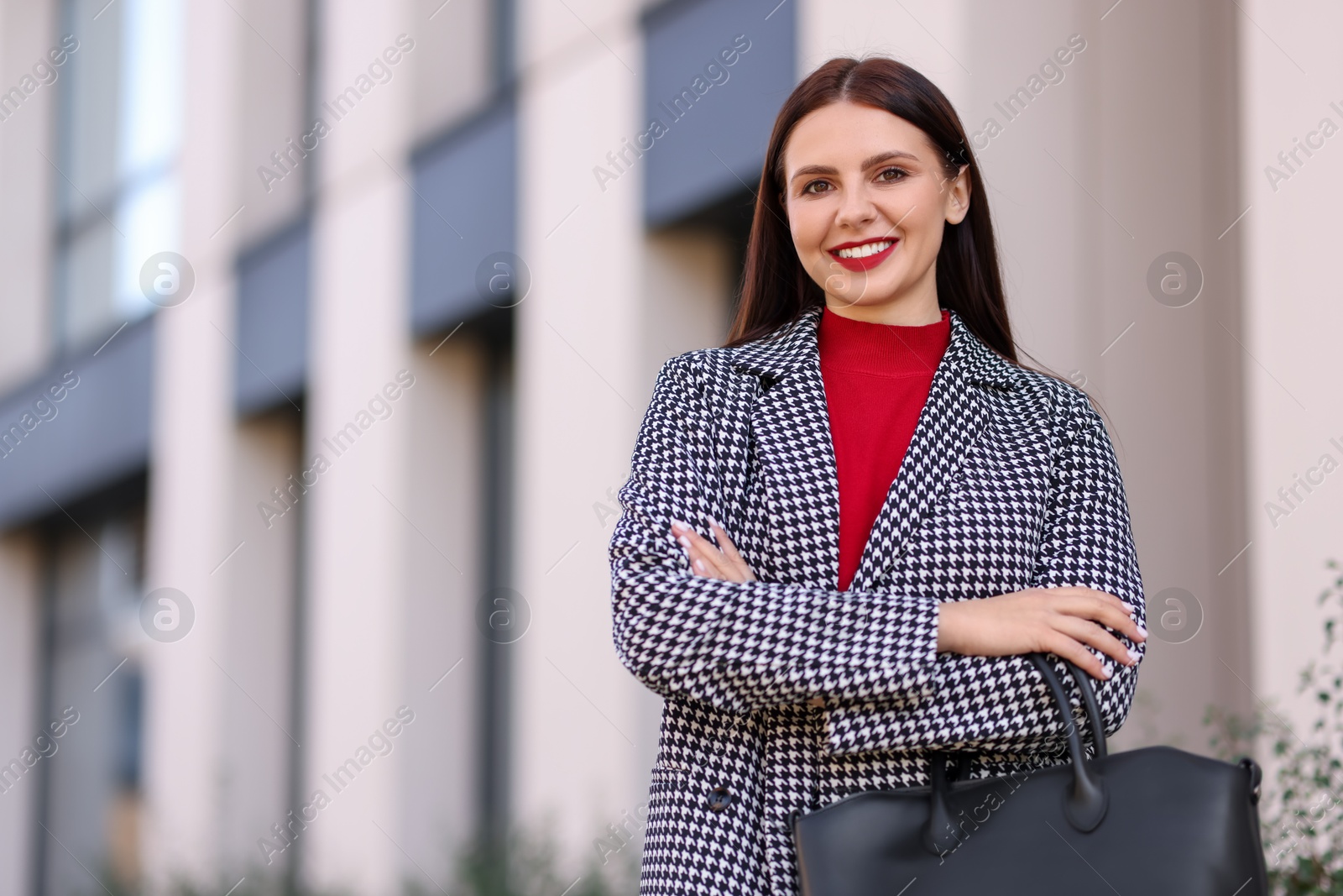 Photo of Beautiful woman in stylish suit outdoors. Space for text