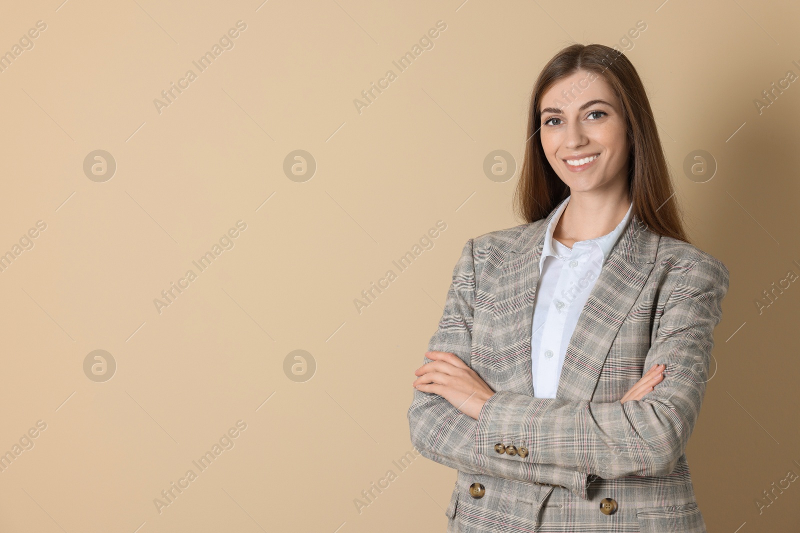 Photo of Portrait of smiling banker on beige background. Space for text