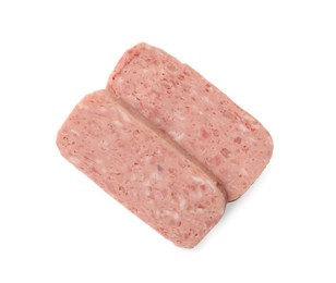 Photo of Pieces of canned meat isolated on white, top view