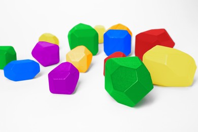 Image of Many balancing stones in LGBT colors on white background. Tolerance and acceptance