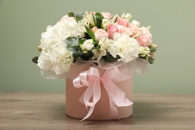 Photo of Bouquet of beautiful flowers on wooden table