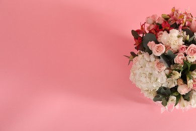 Photo of Bouquet of beautiful flowers on pink background, top view. Space for text