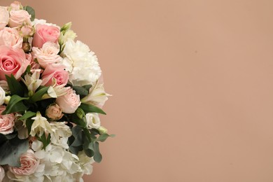 Photo of Bouquet of beautiful flowers on beige background, top view. Space for text