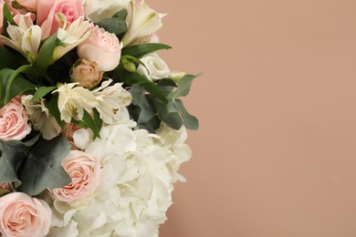 Photo of Bouquet of beautiful flowers on beige background, top view. Space for text