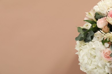 Photo of Bouquet of beautiful flowers on beige background, top view. Space for text