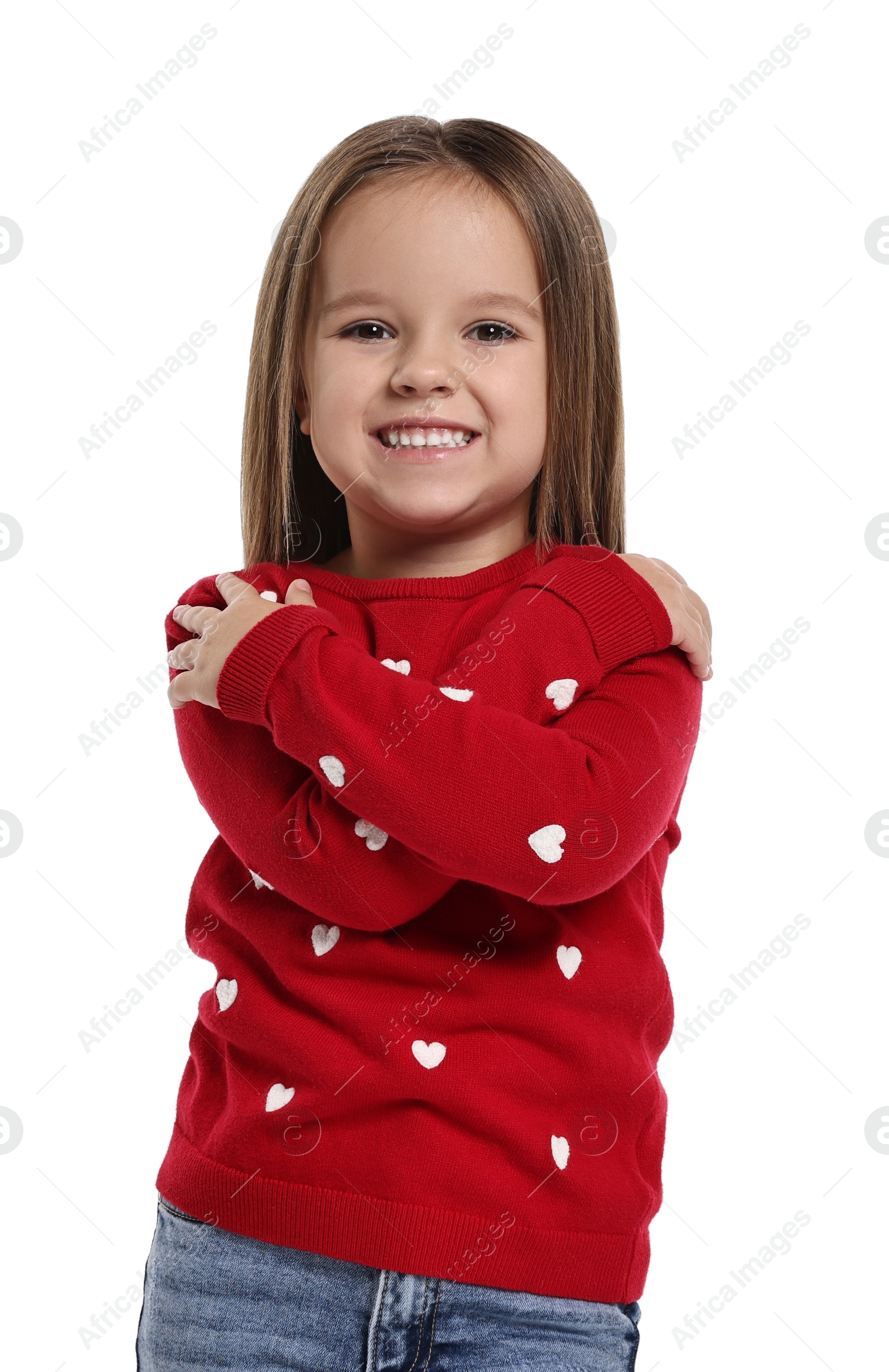 Photo of Cute little girl hugging herself on white background