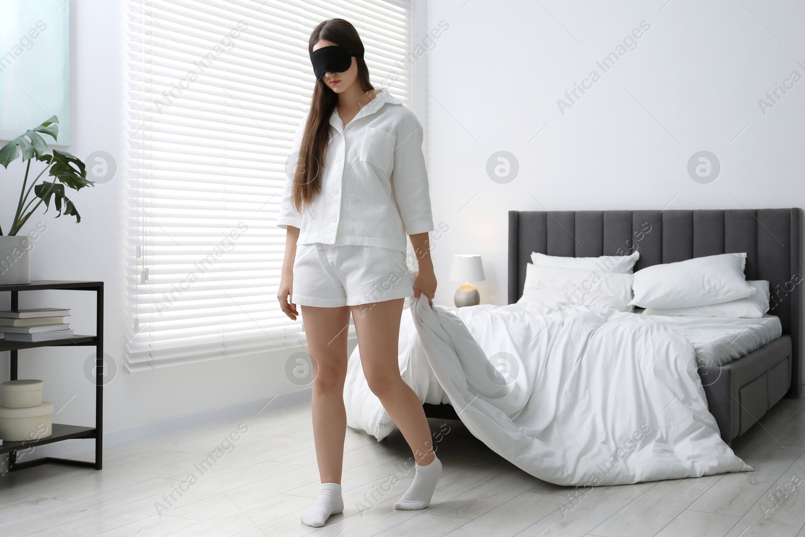 Photo of Young woman suffering from sleepwalking at home