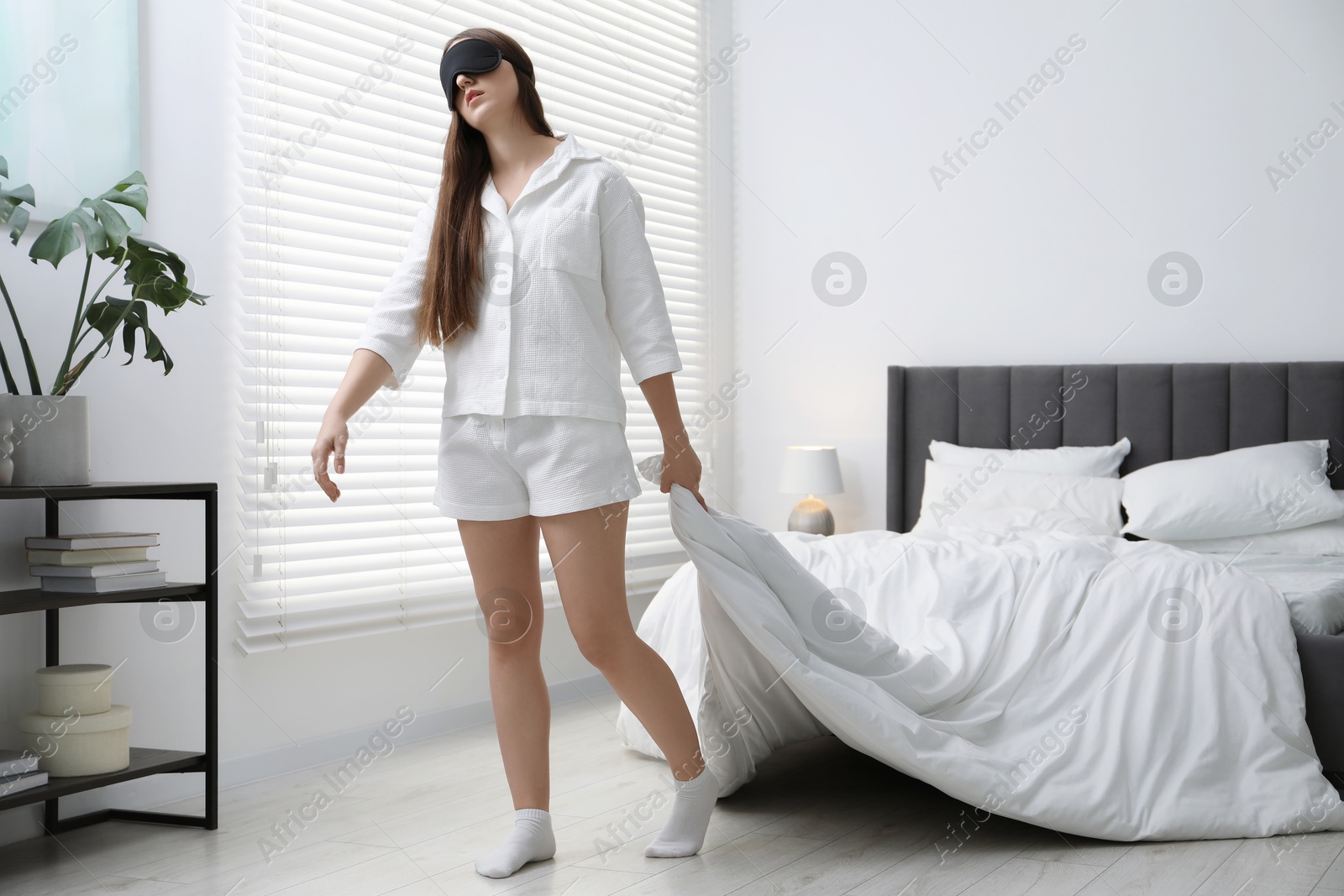 Photo of Young woman suffering from sleepwalking at home