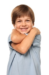 Cute little boy hugging himself on white background