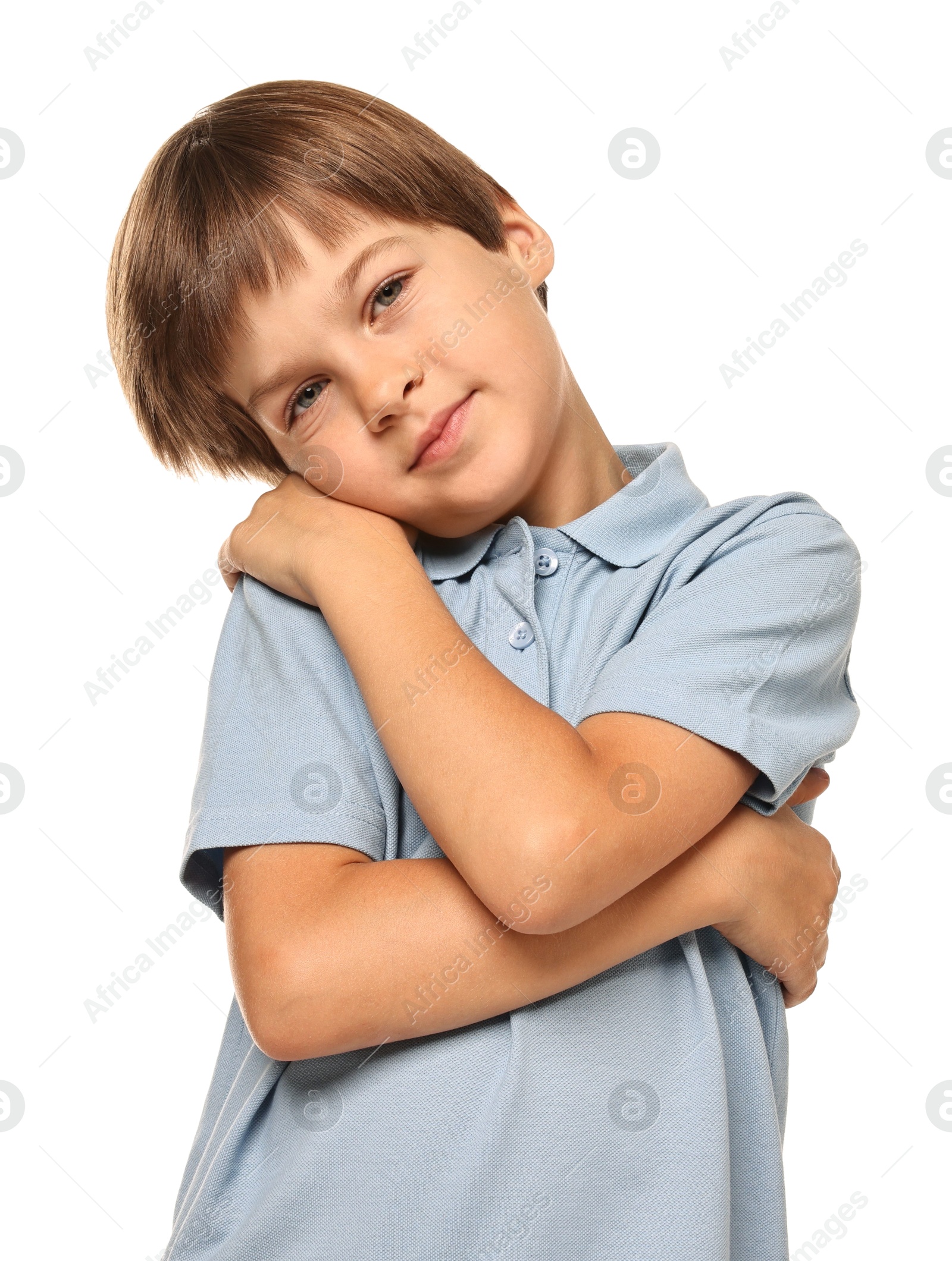 Photo of Cute little boy hugging himself on white background