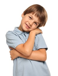 Photo of Cute little boy hugging himself on white background