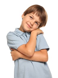 Photo of Cute little boy hugging himself on white background