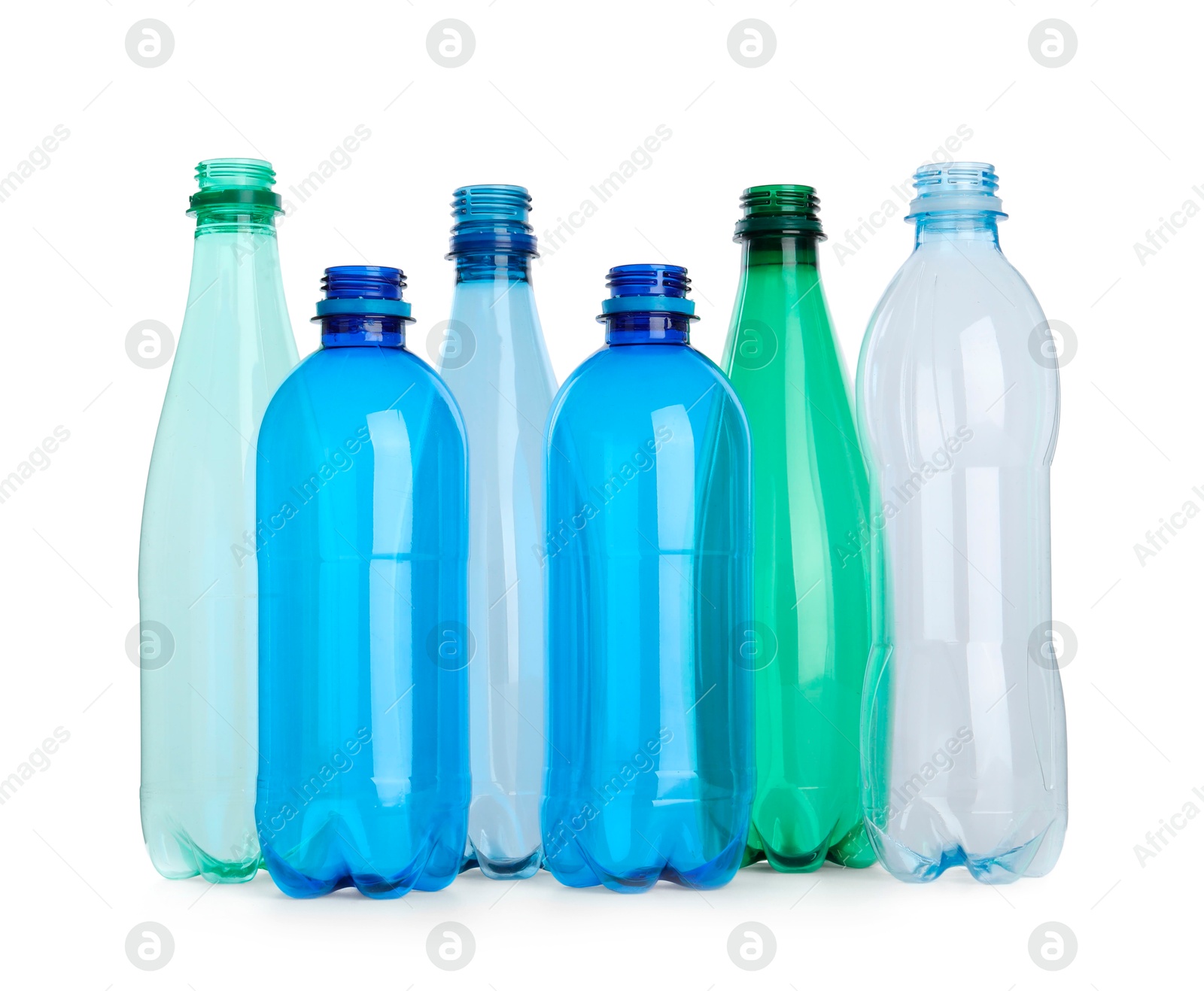 Photo of Many empty plastic bottles isolated on white