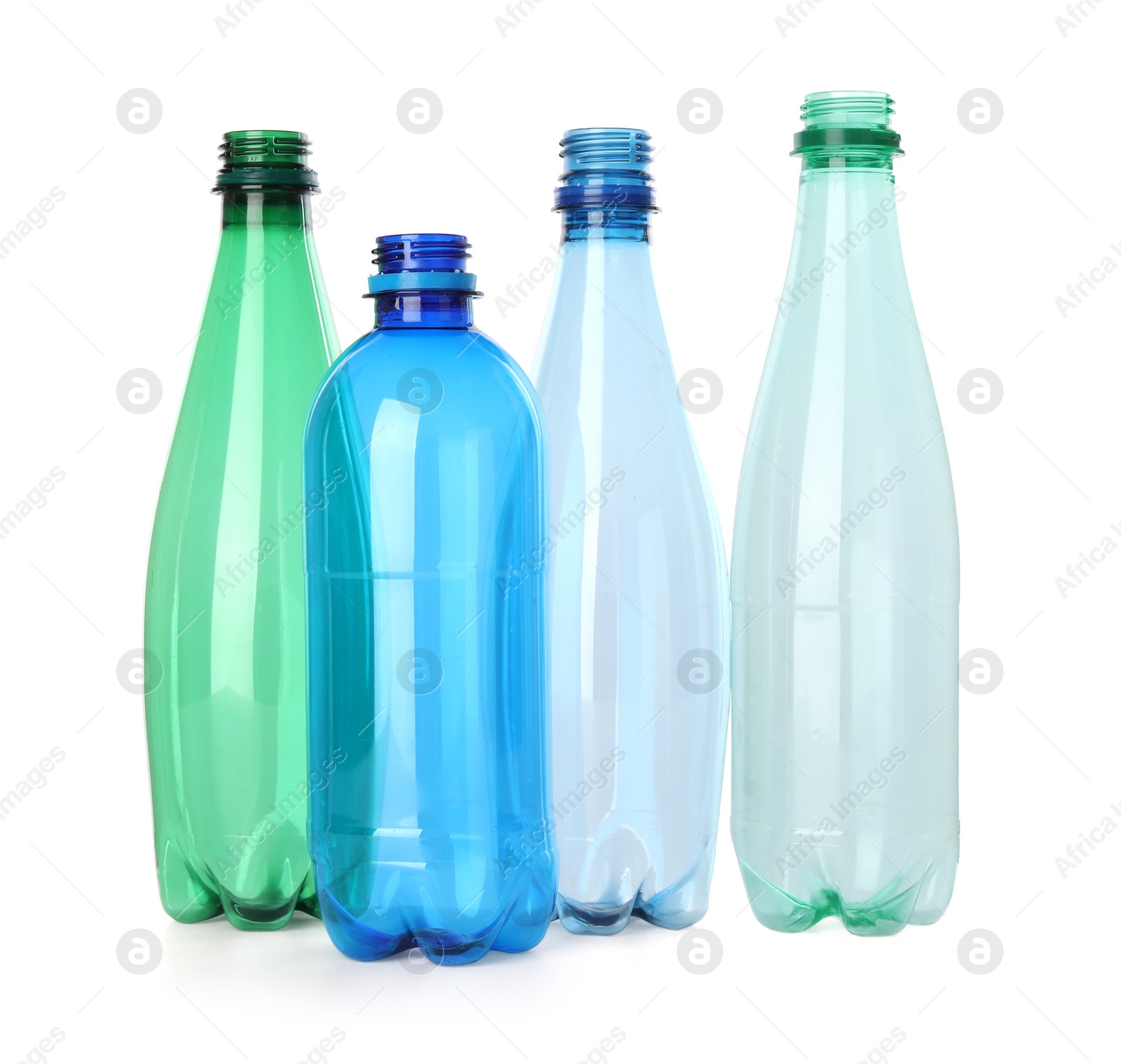 Photo of Many empty plastic bottles isolated on white