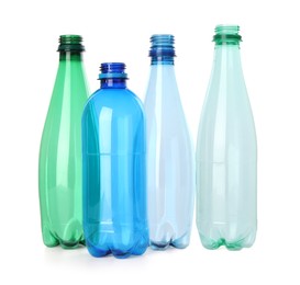 Photo of Many empty plastic bottles isolated on white