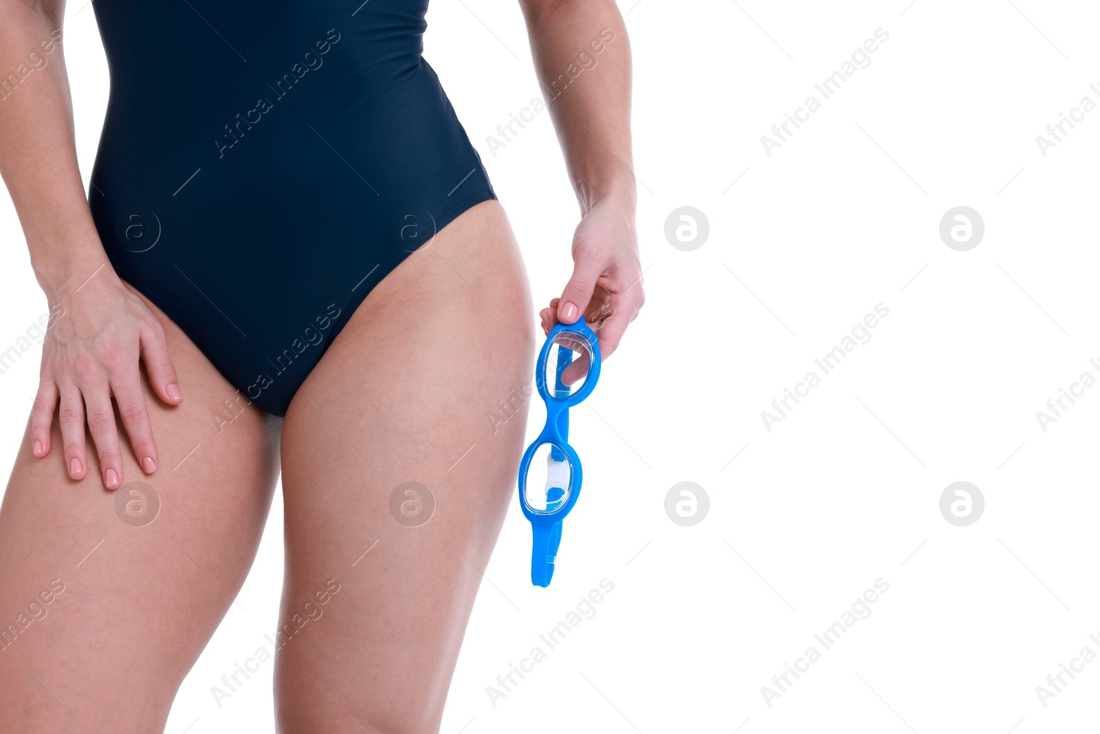 Photo of Professional sportswoman in swimsuit with swimming goggles on white background, closeup