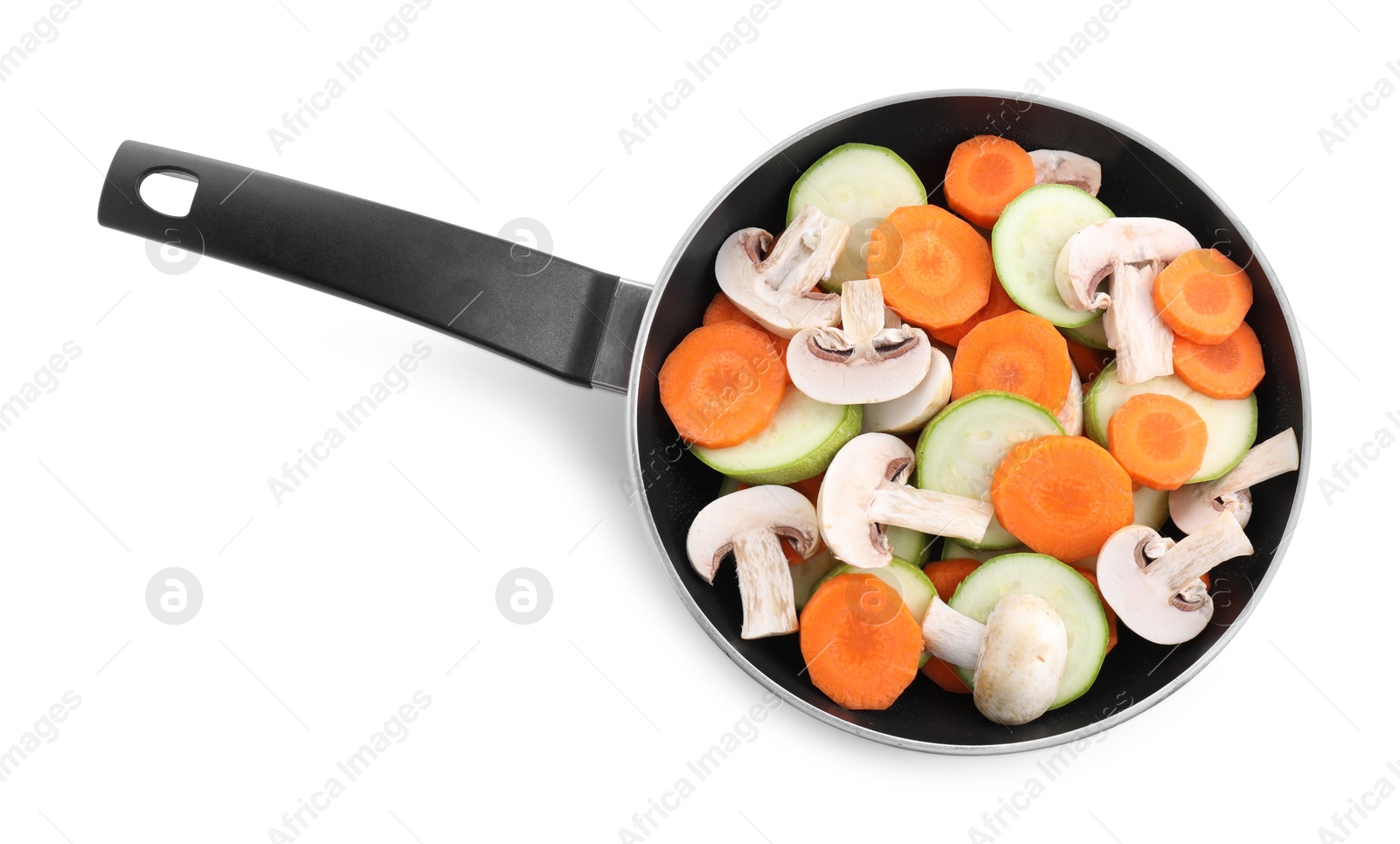 Photo of Frying pan with fresh vegetables and mushrooms isolated on white, top view