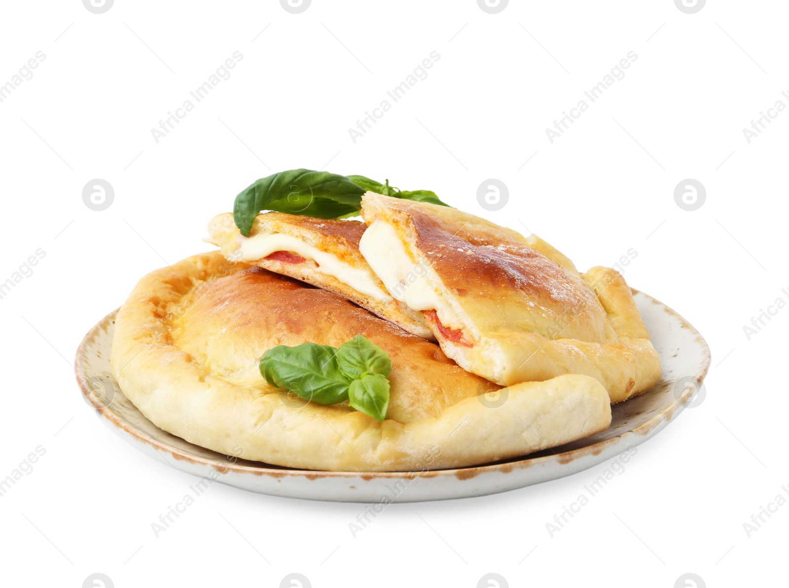 Photo of Pieces of delicious calzone pizza with mozzarella, tomatoes and basil isolated on white