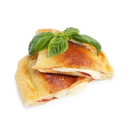 Photo of Pieces of delicious calzone pizza with mozzarella, tomatoes and basil isolated on white