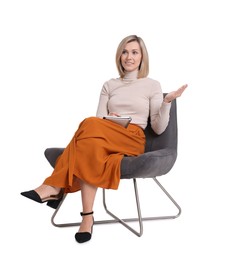 Professional psychologist with notebook sitting on chair against white background