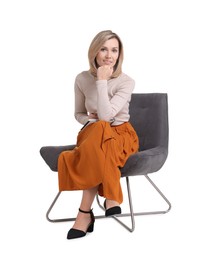 Photo of Professional psychologist with notebook sitting on chair against white background