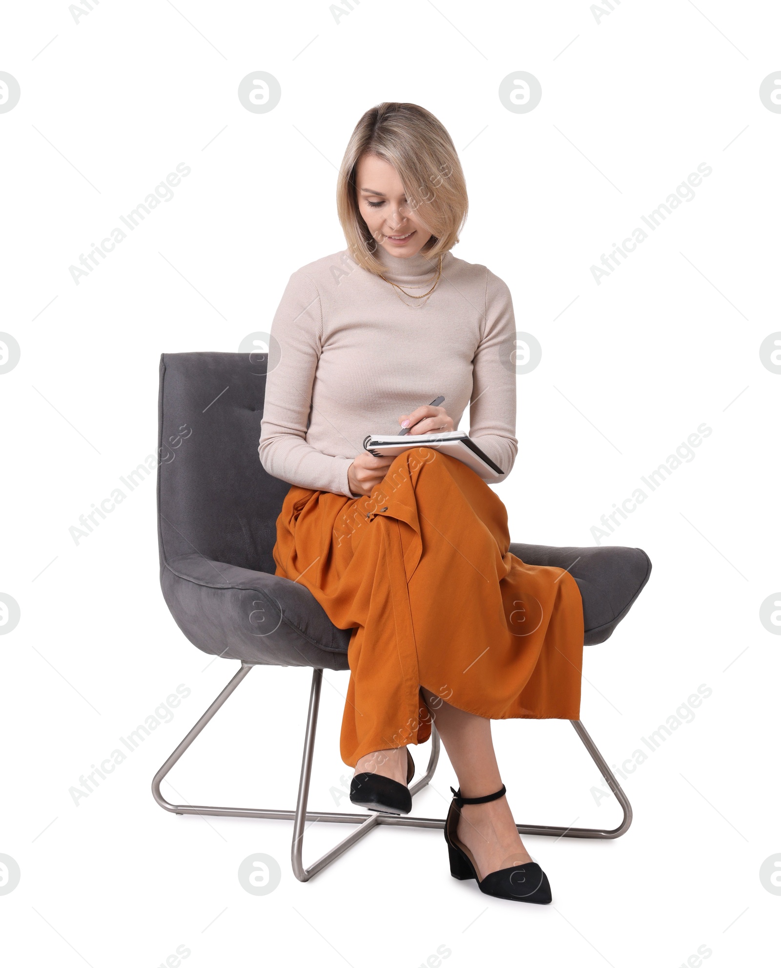 Photo of Professional psychologist with notebook sitting on chair against white background