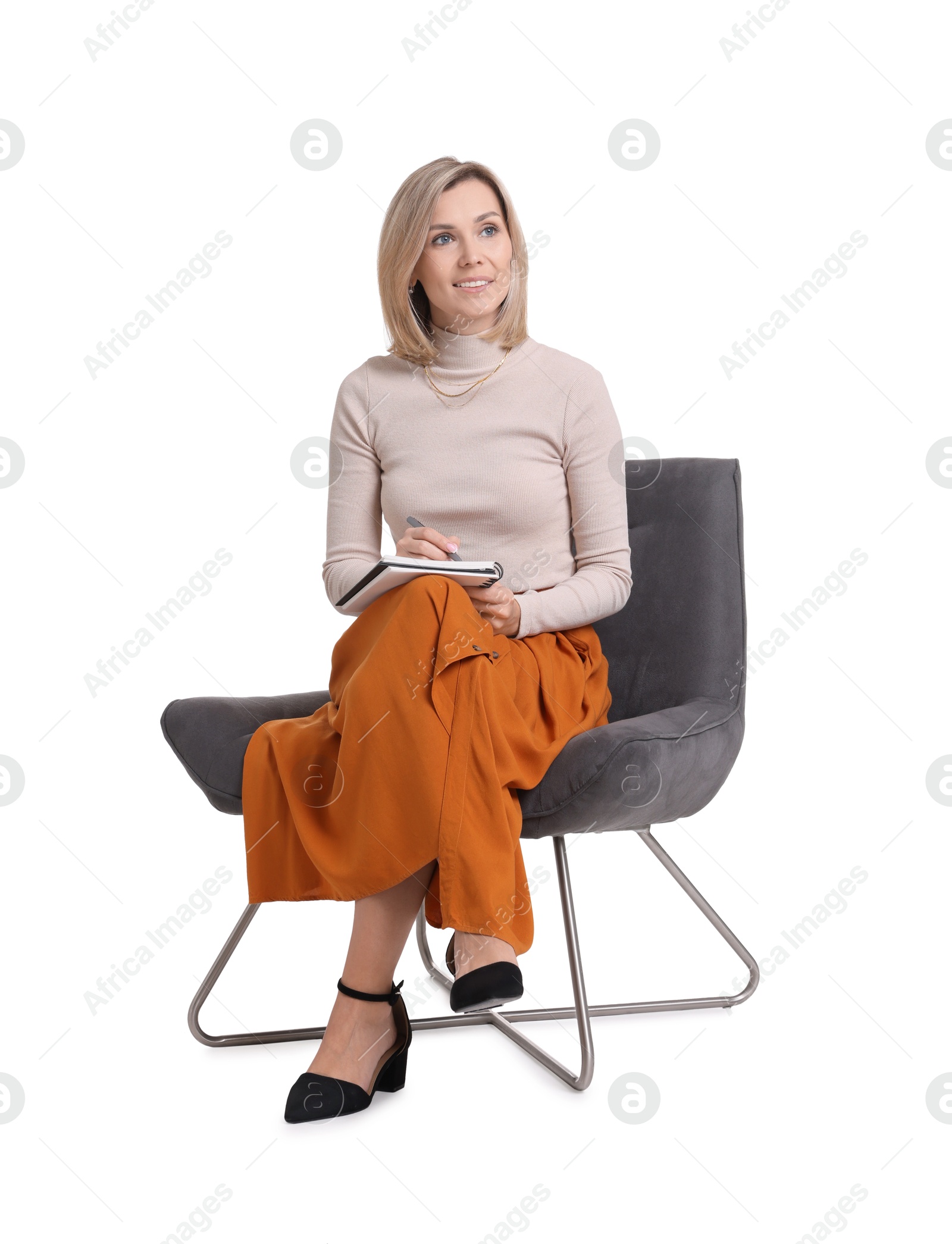 Photo of Professional psychologist with notebook sitting on chair against white background