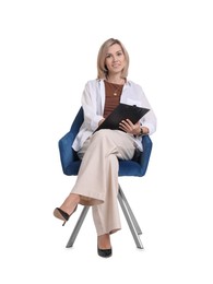 Professional psychologist with clipboard sitting on chair against white background