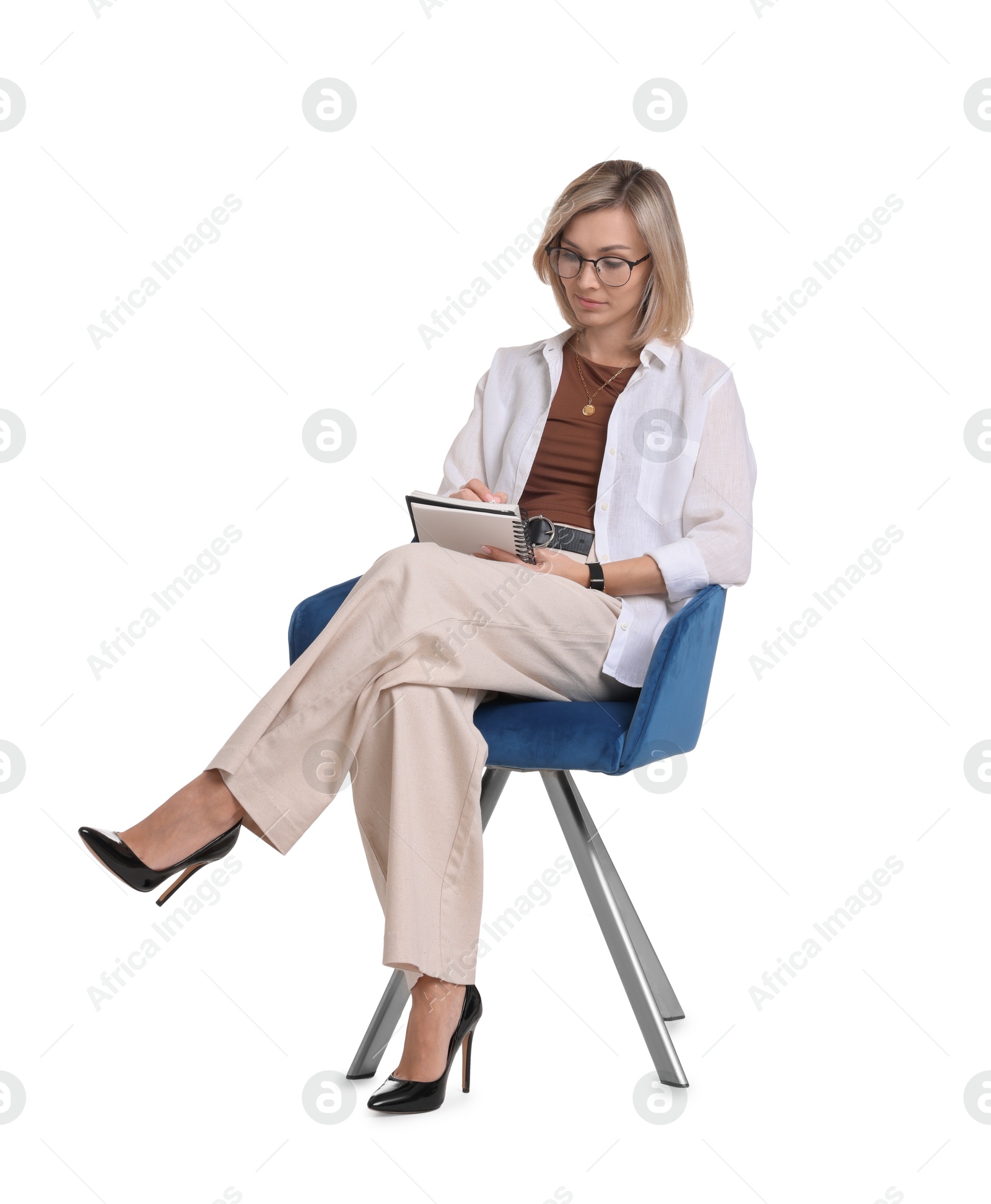 Photo of Professional psychologist with notebook sitting on chair against white background