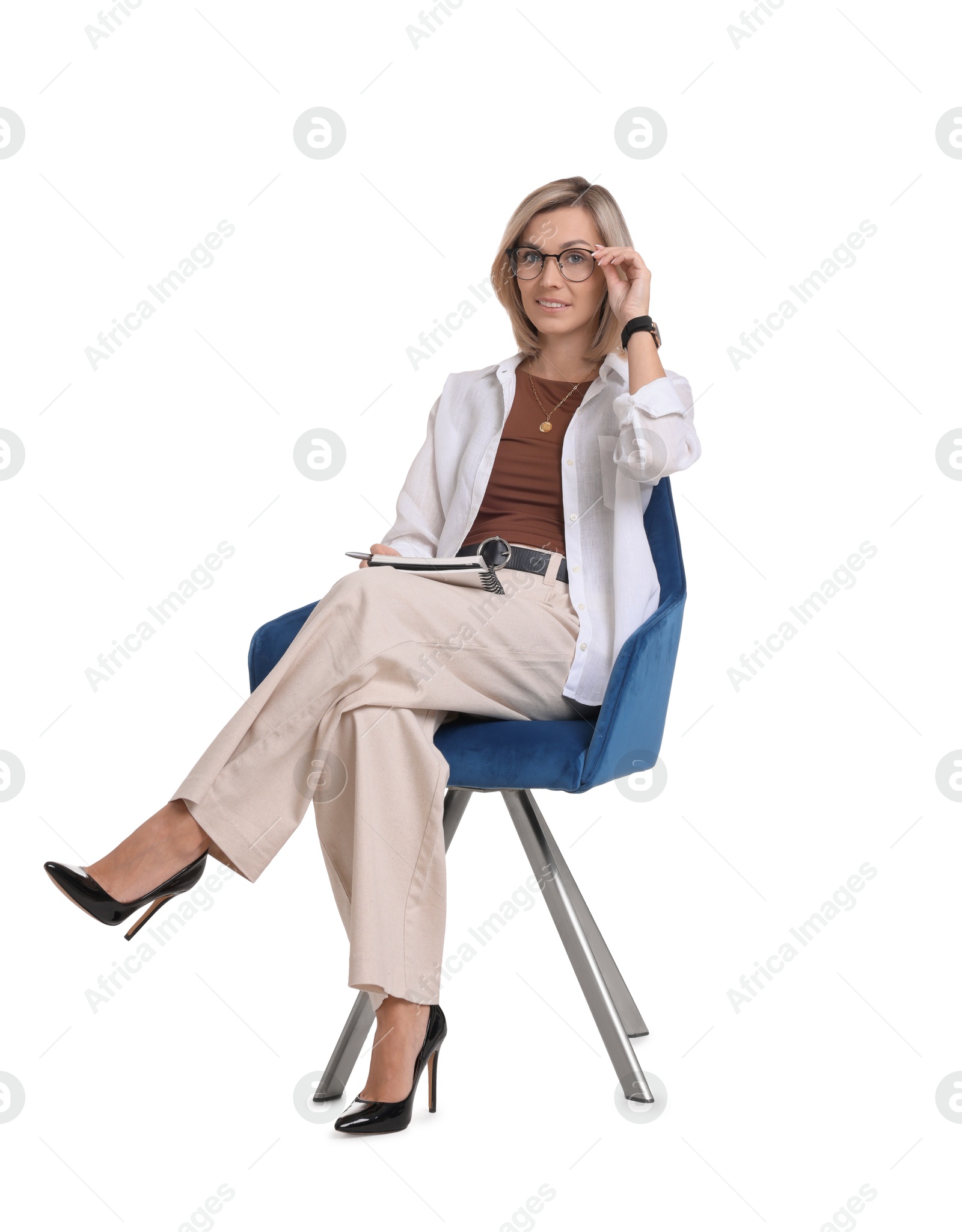 Photo of Professional psychologist with notebook sitting on chair against white background