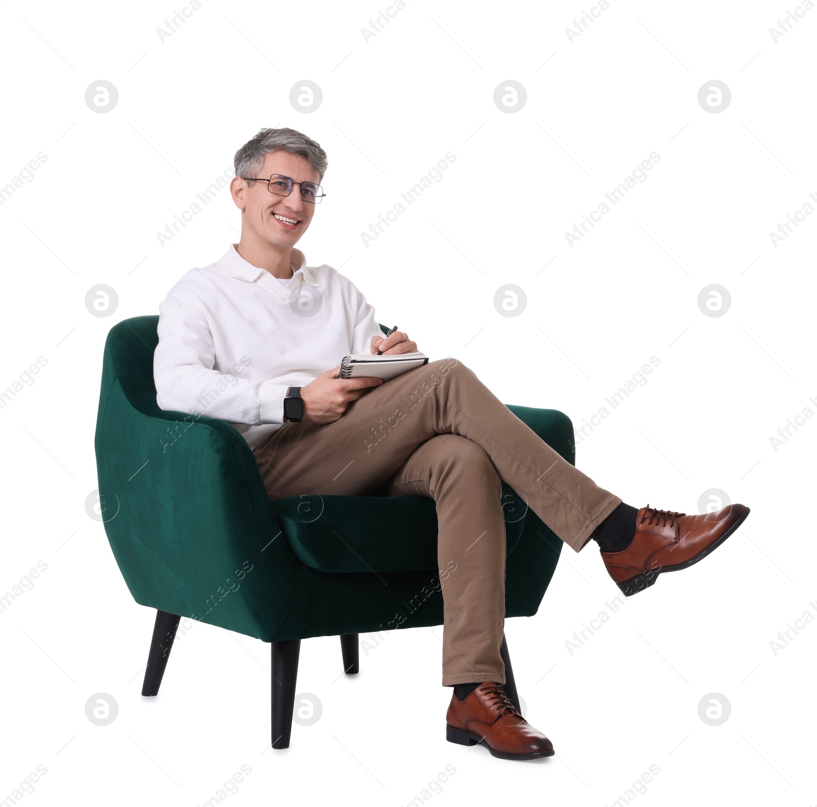 Photo of Professional psychologist with notebook sitting on chair against white background