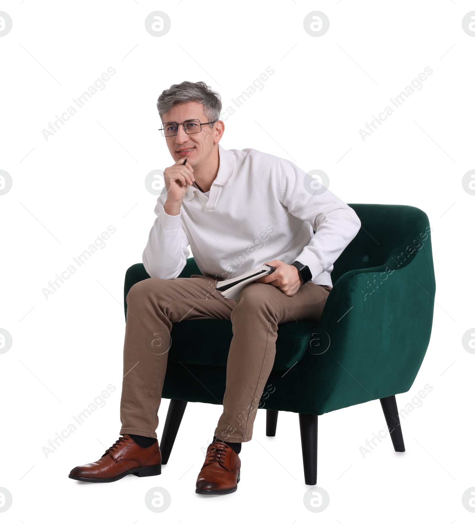 Photo of Professional psychologist with notebook sitting on chair against white background