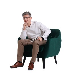 Photo of Professional psychologist with notebook sitting on chair against white background