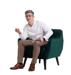 Photo of Professional psychologist with notebook sitting on chair against white background