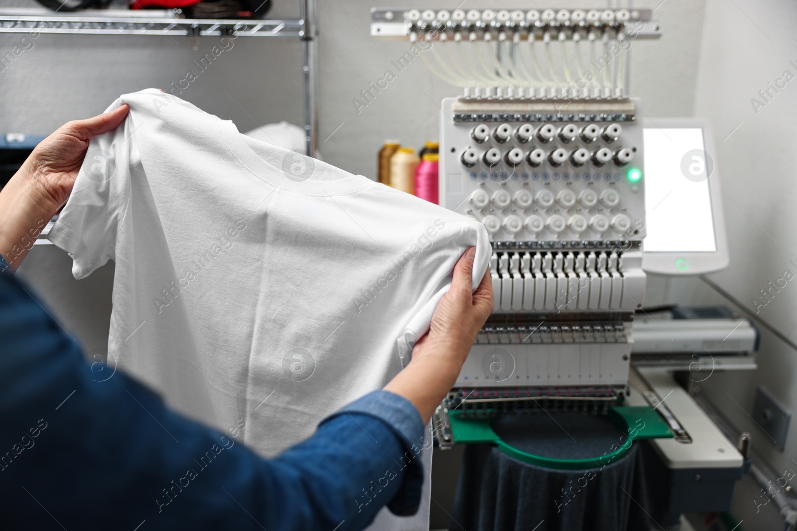 Photo of Woman with blank T-shirt for print indoors, closeup