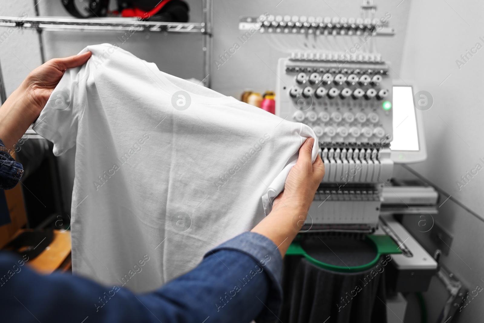 Photo of Woman with blank T-shirt for print indoors, closeup