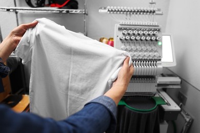 Photo of Woman with blank T-shirt for print indoors, closeup