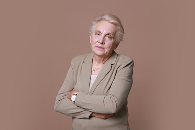 Photo of Portrait of senior woman on color background